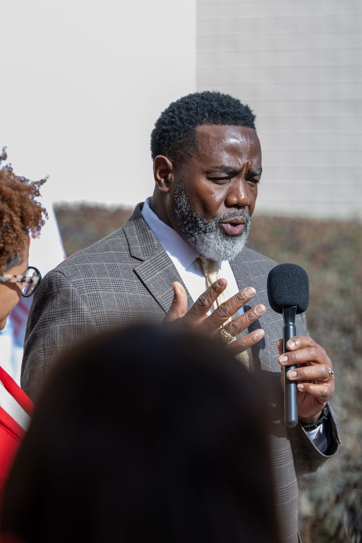 A speaker at the flag raising ceremony