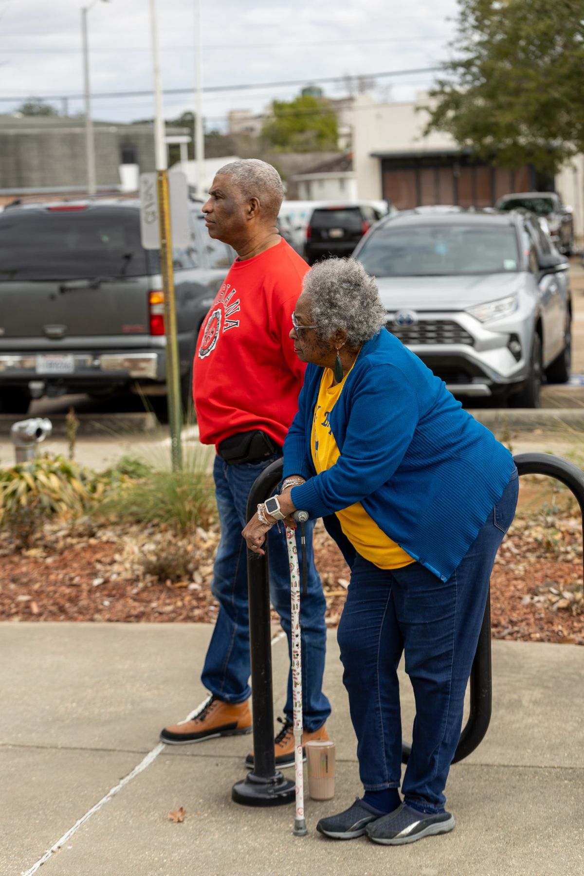 An elder with a cane on the walk