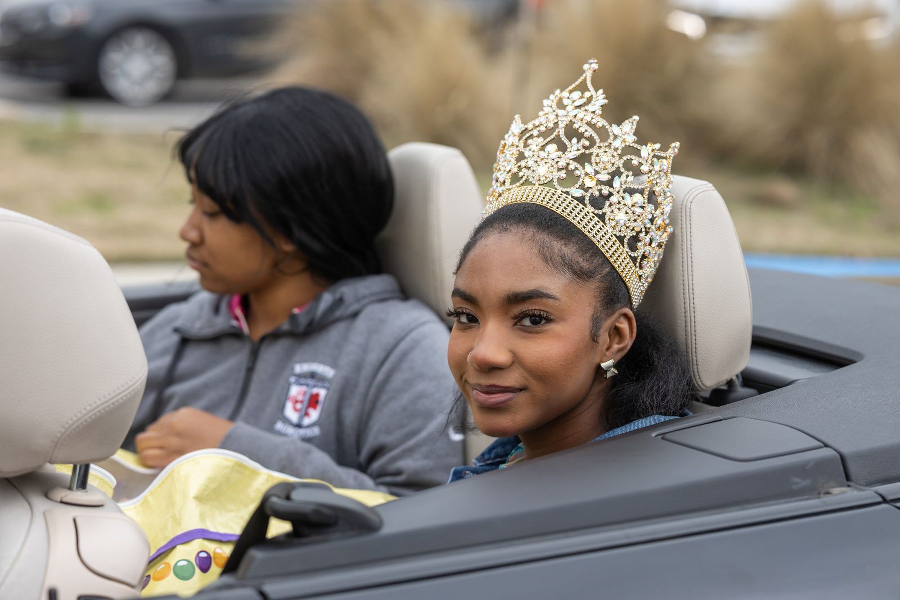 A young parade queen in a crown