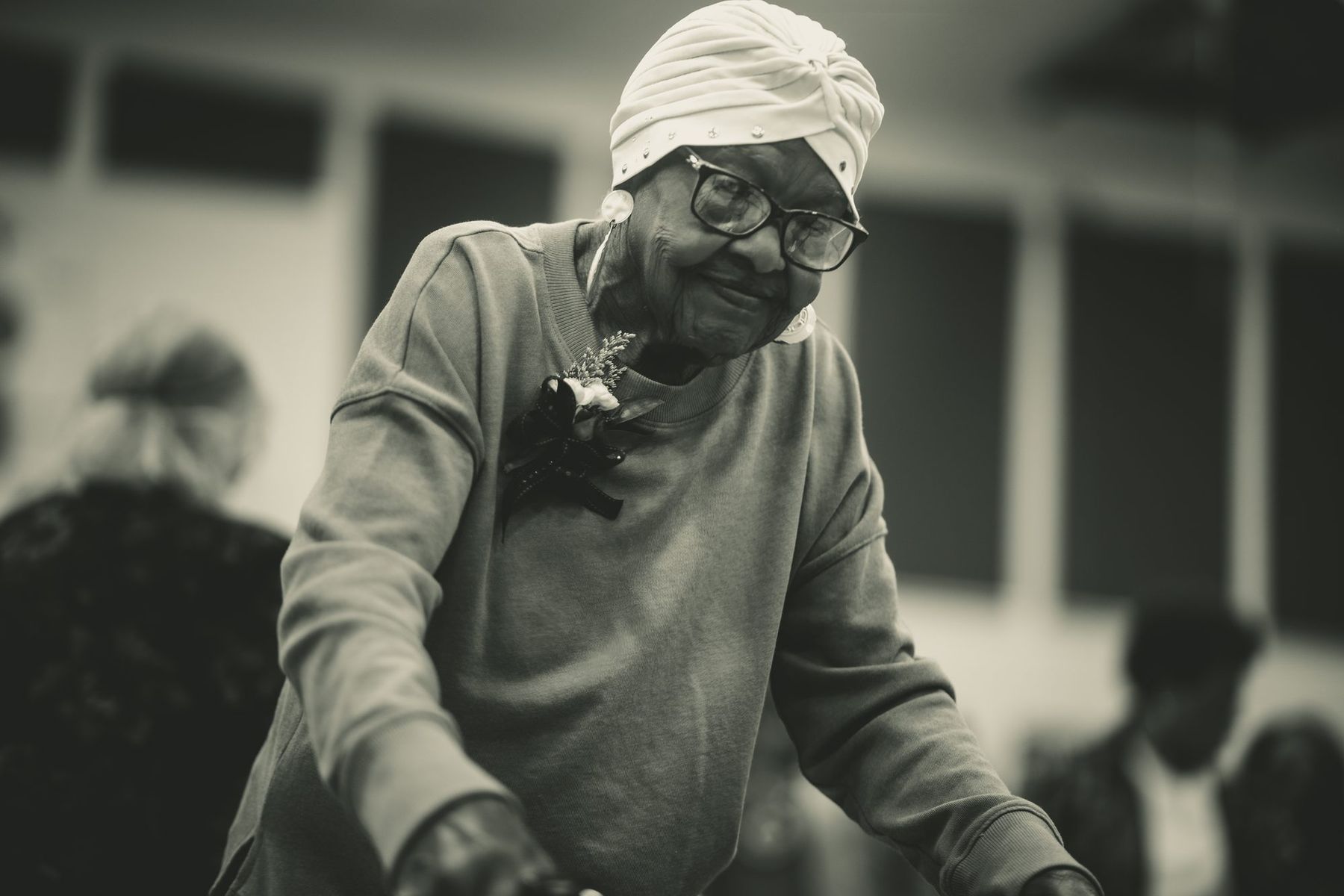 An elder in a white head wrap