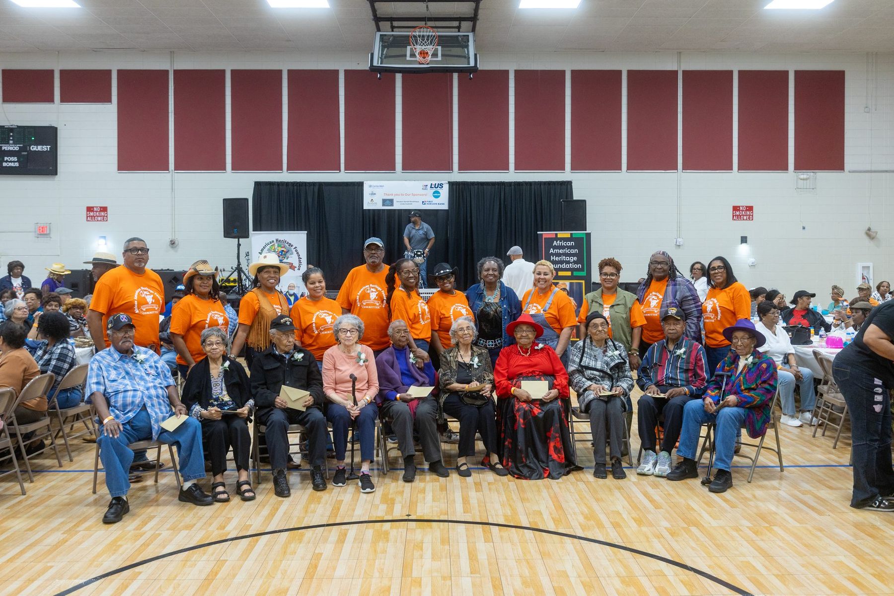 Honorees and volunteers lined up across the floor at Senior Citizens Thank You Day